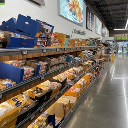 a grocery store with shelves of food a grocery store with shelves of food