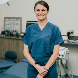 Same Day Teeth - Coastal Jaw Surgery - Dr. Lindsey Pikos Rosati, board-certified periodontist and implant specialist, in the operatory room at Same Day Teeth® office