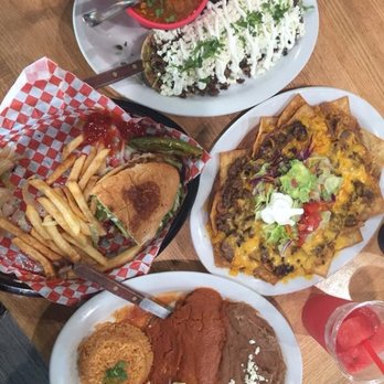Erick's Tacos y Fruteria - Huarache, top. Torta, left. Nachos appetizer, right. Chile relleno, bottom. - Mexican Near Me - Cibolo, Texas Erick's Tacos y Fruteria - Huarache, top. Torta, left. Nachos appetizer, right. Chile relleno, bottom. - Mexican Near Me - Cibolo, Texas