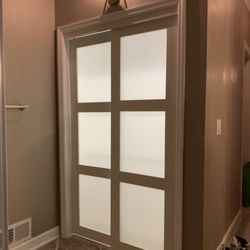 Handy Pro Solutions - In this area a vanity was removed and a closet with inside lighting and glass doors was built