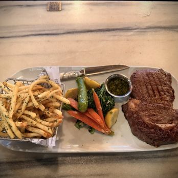Savoie Italian Eatery - The Rib Eye Steak with vegetables & truffle parmesan fries - Italian Near Me - Chula Vista, California Savoie Italian Eatery - The Rib Eye Steak with vegetables & truffle parmesan fries - Italian Near Me - Chula Vista, California