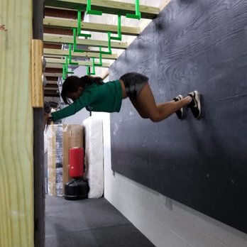 Dragon Fit Ninja Warrior - working on upper body doing the body prop obstacle - Circuit Training Gyms Near Me - Spring Hill, Florida