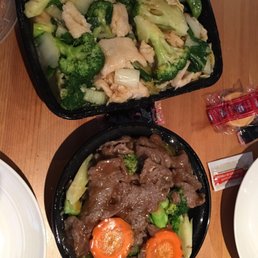 Top: chicken chow mein, noodles are at the bottom. Bottom: beef with broccoli Top: chicken chow mein, noodles are at the bottom. Bottom: beef with broccoli