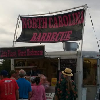 Little Piggy's Wurst Nightmare - a group of people standing in front of a food truck - Food Trucks Near Me