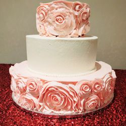 Roberts Fine Cakes - Pretty pink 3 tier flowered cake. Delicious and moist tasting.