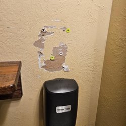 Bayside Grille - Screw holes left unrepaired when soap dispenser moved a year ago!