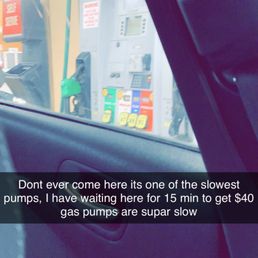 a view of a gas pump from inside a car a view of a gas pump from inside a car