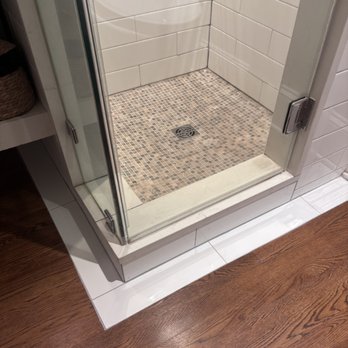 Evermore Construction - Tile surround added because hardwood was being affected by dripping water. - General Contractors Near Me - Mars Hill, North Carolina