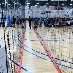 Momentous Sports Center - Netted walkway in between courts