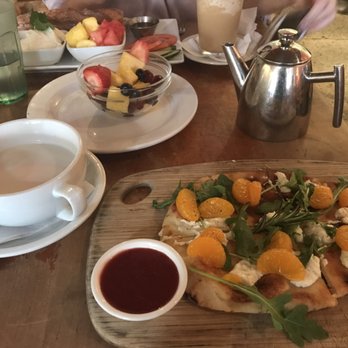 Tryst - Masala chai + mandarin flatbread (w/o prosciutto). Fruit bowl and labneh+baguette in the back! - Lounges Near Me - Washington, DC, District of Columbia