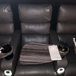 Cinépolis Luxury Cinemas - Seating Area with tray. The tray sits high, and the seat sits low.