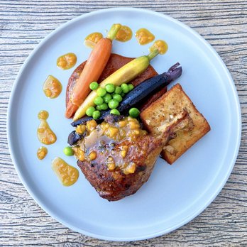 Acopio - Pipián Rojo Con Pato: Chile Adobo Duck Confit Leg w/ lemon-thyme masa cake, green peas, baby carrots, apricot-dijon demi | $29 - New Mexican Cuisine Near Me - San Jose, California Acopio - Pipián Rojo Con Pato: Chile Adobo Duck Confit Leg w/ lemon-thyme masa cake, green peas, baby carrots, apricot-dijon demi | $29 - New Mexican Cuisine Near Me - San Jose, California