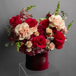 Floral arrangement in a red velvet box