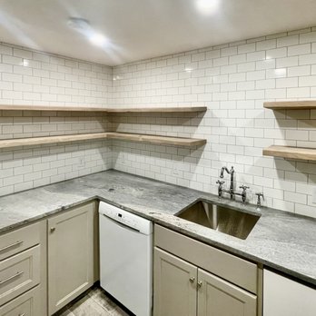 Alpha Tile - a kitchen with a washer and dryer - Tiling Near Me - Overland Park, Kansas