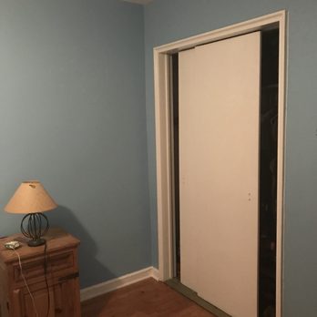 Smart Painting - a room with a door and a lamp - Painters Near Me