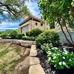 OSR Exteriors - Home in Horseshoe Bay where we installed mulch, flowers, and trimmed all the landscaping that had not been trimmed in over 5 years.