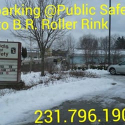 Big Rapids Roller Rink - Beloved big ugly blue building in background is Big Rapids Roller Rink.  The free parking is foreground at Public Safety.