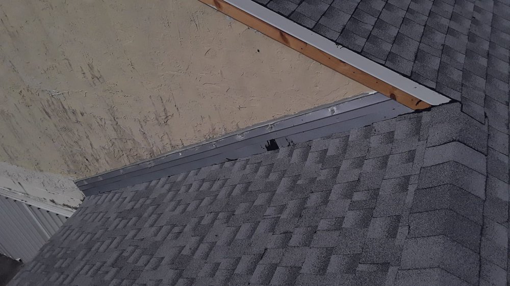 Slide of The Roof Xperts