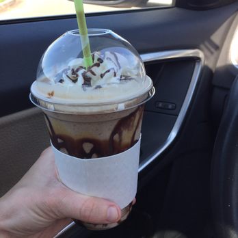 A Latte Love Coffeehouse - a hand holding a cup of coffee - Coffee & Tea Near Me - Yukon, Oklahoma