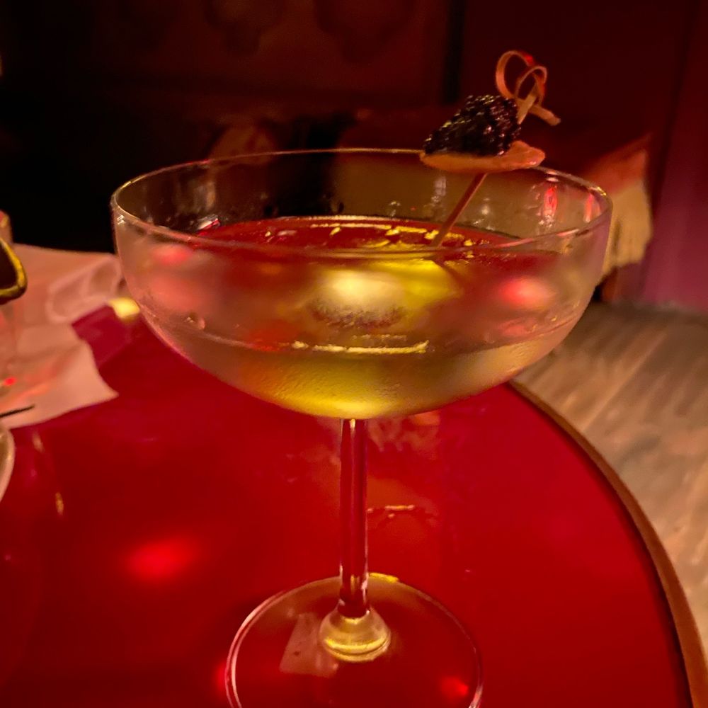 a martini with olives in it a martini with olives in it