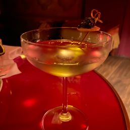 a martini with olives in it a martini with olives in it