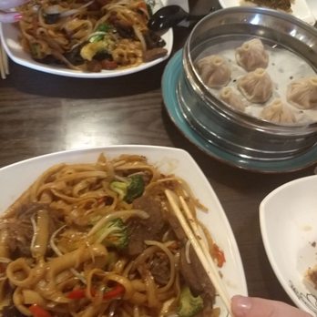 LanZhou Ramen - Shaved chicken (top) and beef (bottom) stir fried noodles with soup dumplings on the tray. - Chinese Near Me - Doraville, Georgia LanZhou Ramen - Shaved chicken (top) and beef (bottom) stir fried noodles with soup dumplings on the tray. - Chinese Near Me - Doraville, Georgia