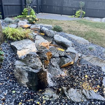 West on Warren Gallery + Grill - a water feature in the backyard - American Near Me - Middlebury, Indiana