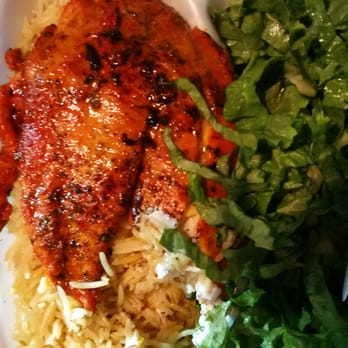 Gyro King - Tilapia over rice. With a bit a bite already taken (so tasty). - Food Trucks Near Me - Houston, Texas Gyro King - Tilapia over rice. With a bit a bite already taken (so tasty). - Food Trucks Near Me - Houston, Texas