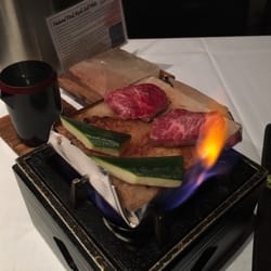 Serious flames under the salt slab with delicious wagyu on it