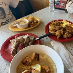 Shrimp and grits, French toast, Catfish and Grit Bowl, chicken, eggs and potatoes