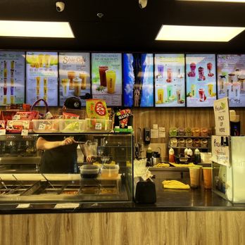 Presotea - a restaurant counter with menus in the background - Bubble Tea Near Me - Brossard, Quebec Presotea - a restaurant counter with menus in the background - Bubble Tea Near Me - Brossard, Quebec