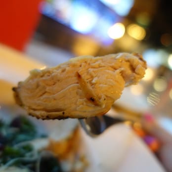 Earls Kitchen + Bar - a piece of food on a fork - Canadian (New) Near Me - Saskatoon, Saskatchewan
