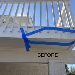 Before fix. Rotted wood under balcony.
