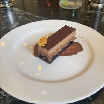 Café Riggs - Chocolate dessert with hazelnut and gold foil - Breakfast & Brunch Near Me - Washington, DC, District of Columbia Café Riggs - Chocolate dessert with hazelnut and gold foil - Breakfast & Brunch Near Me - Washington, DC, District of Columbia