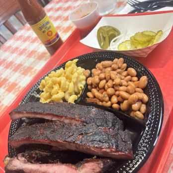 Dozier's BBQ - The plate of ribs, brisket, beans and mac - Meat Shops Near Me - Fulshear, Texas