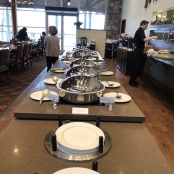 Drift Kitchen + Bar - a long table with plates and bowls on it - Canadian (New) Near Me - Huntsville, Ontario Drift Kitchen + Bar - a long table with plates and bowls on it - Canadian (New) Near Me - Huntsville, Ontario