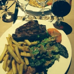 Steak perfectly cooked and fries