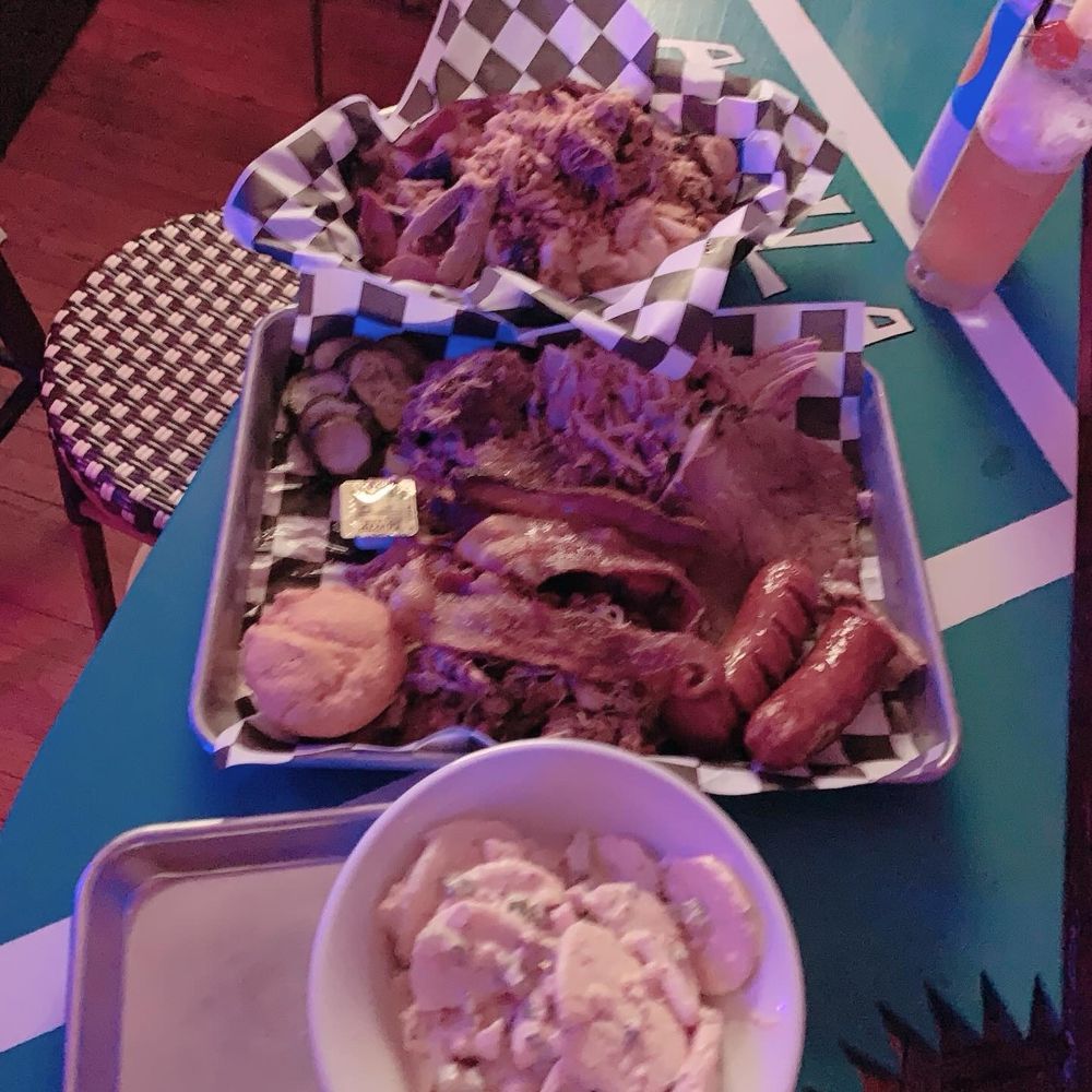 two baskets of food on a table two baskets of food on a table