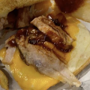 Hometown Heroes - This is supposed to be a pulled pork sandwich. With two pieces of pulled pork on each side. - Sports Bars Near Me - Grinnell, Iowa