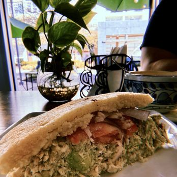 Kolombia Cafe - Reina arepa cut in half. - Cafes Near Me - Orlando, Florida Kolombia Cafe - Reina arepa cut in half. - Cafes Near Me - Orlando, Florida