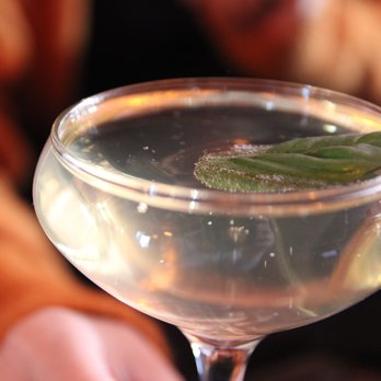 Filthy Diamond - a person holding a glass of wine - Cocktail Bars Near Me - New York, New York