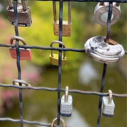 Love locks are placed by couples on fence with their initials & dates to show their inseparable bonds! Love locks are placed by couples on fence with their initials & dates to show their inseparable bonds!