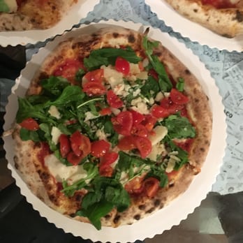 Gusta Pizza - "Gusta" pizza with mozzarella, cherry tomatoes and arugula. - Italian Near Me - Florence, FI