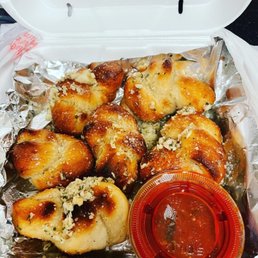 a container of pizza and sauce a container of pizza and sauce