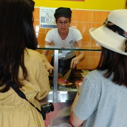 This is the unpleasant woman who was rude to me because I lacked specifity about what kind of cheese pizza I wanted.