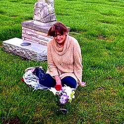 Washington Park North Cemetery Burial & Cremation Services - Elizabeth visiting her son Thomas Eric's gravesite, next to the angel statue, on May 20, 2019, on her first visit home after five years.