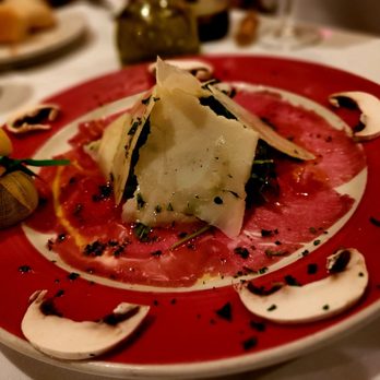 Trattoria Luna - a plate of food on a table - Italian Near Me - Miami, Florida