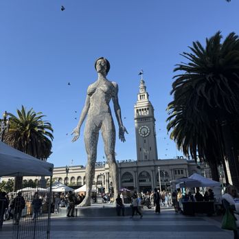 Ferry Building Marketplace - Outside with statue from burning man - Public Markets Near Me - San Francisco, California Ferry Building Marketplace - Outside with statue from burning man - Public Markets Near Me - San Francisco, California