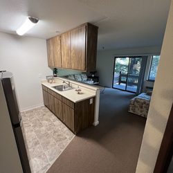 Valley Orchards Retirement Community - Kitchen, living room, and balcony