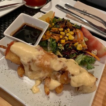 El Sur - Brochetas de salmón - Tapas Bars Near Me - Madrid, M